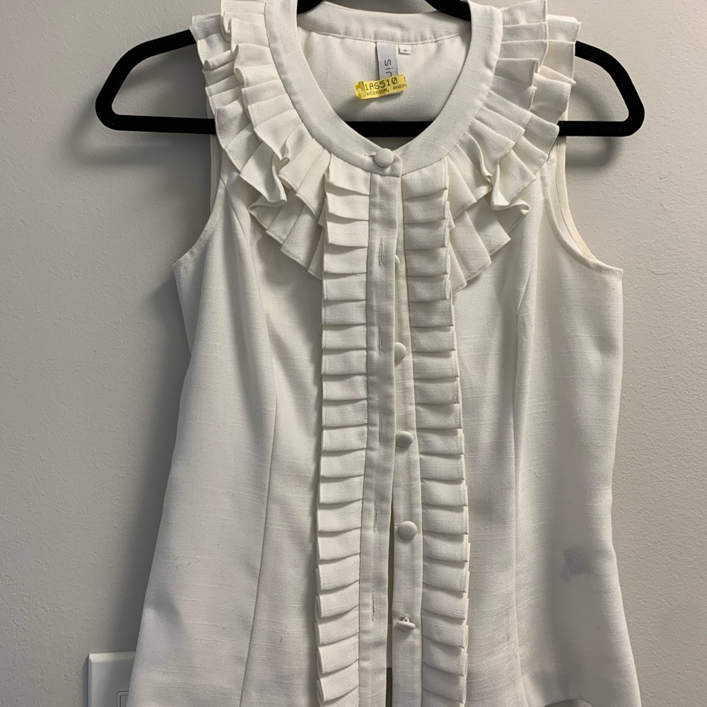 White sleeveless blouse